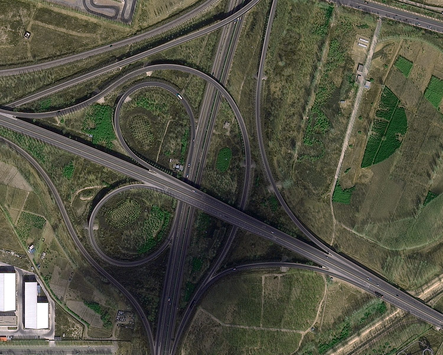 0.5 m satellite image of a highway interchange and industrial zone